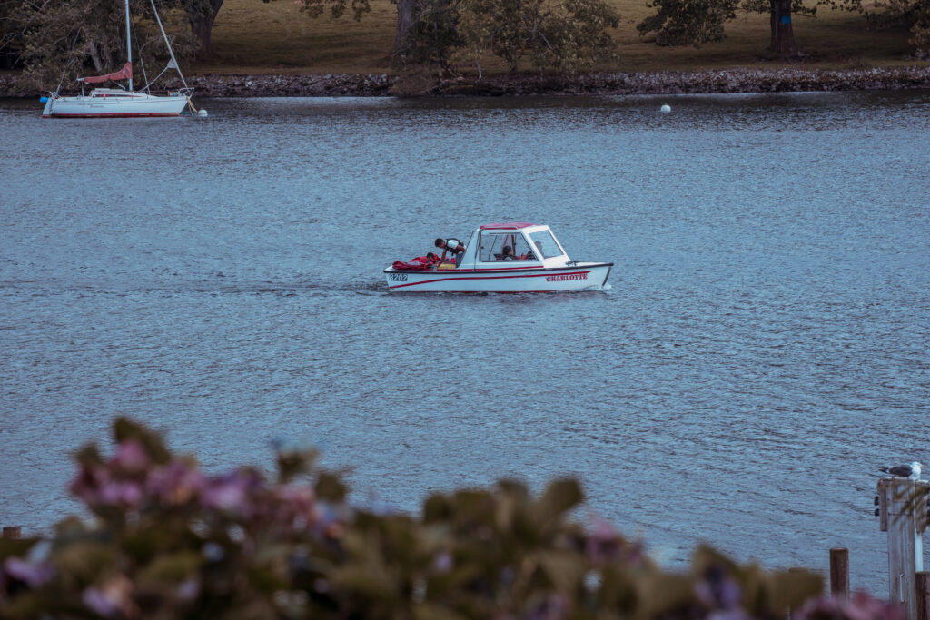 boat on lake windermere outside lakeside hotel