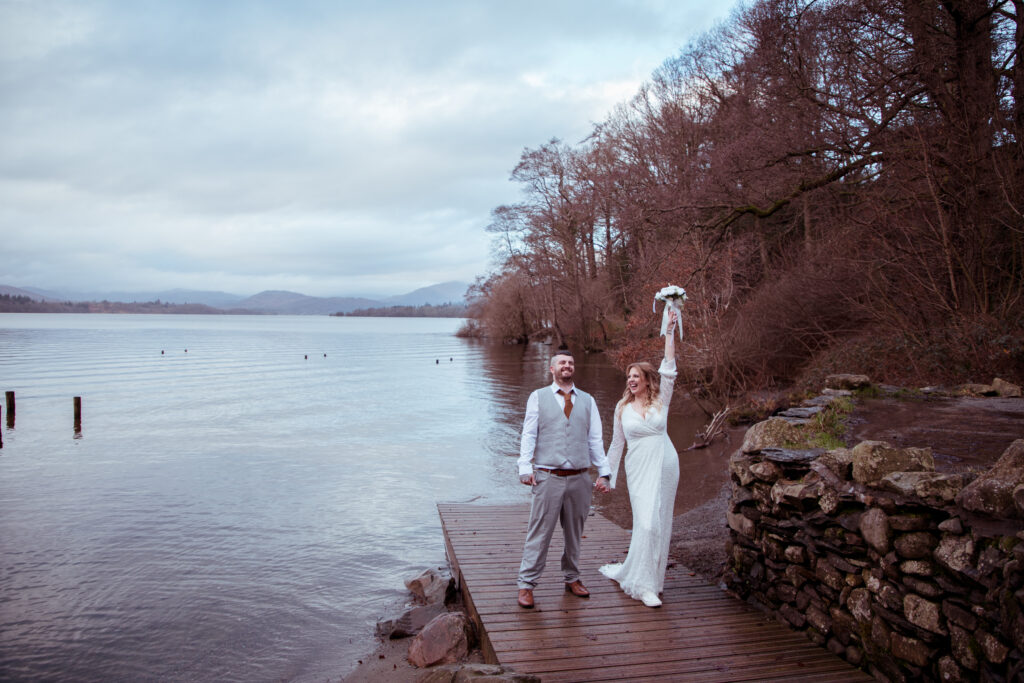 happy couple laughing on lake windermere